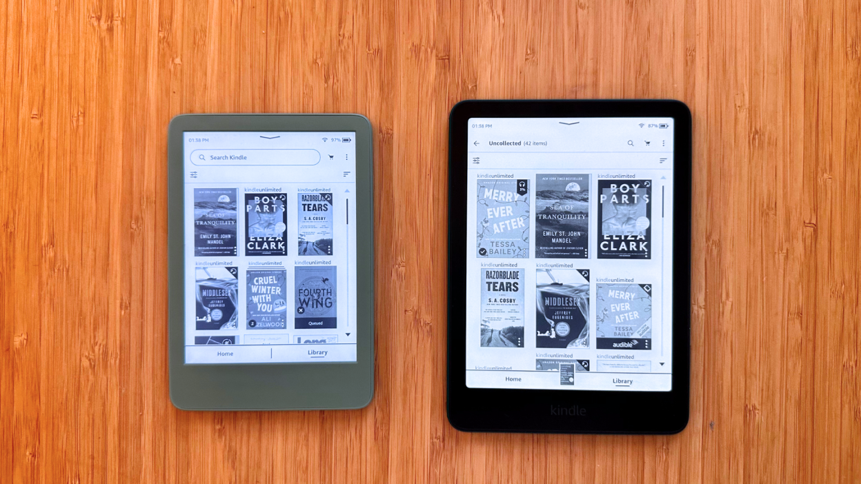 A basic Kindle and a Kindle Paperwhite on a table.