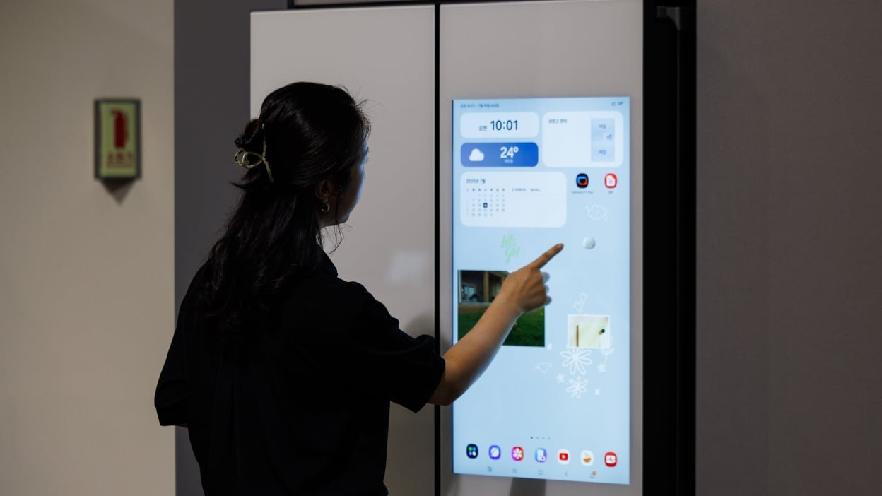 An employee demonstrates an AI refrigerator inside the Samsung Electronics Co. Innovation Museum at the company