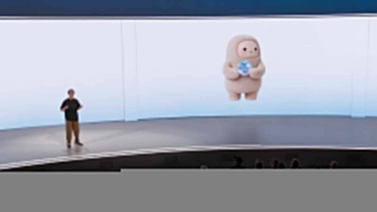 mark zuckerberg on stage with the muse mascot jolly